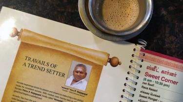 P Rajagopal, founder of the Saravana Bhavan food chain, pictured on a menu at one of the popular restaurants