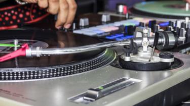 A close-up of a DJ at work