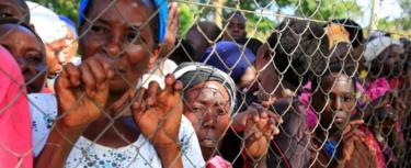 People at the scene of the Uganda sinking