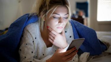 Woman checking smartphone