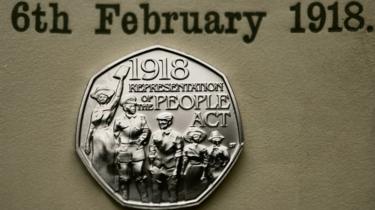 The new 50p coin, photographed here against the paper copy of the Act, will be in general circulation later this year