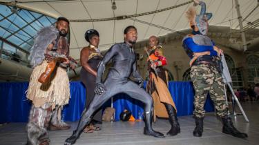 Fans dressed as characters from Marvel's Black Panther movie attend Comic-Con International on July 20, 2018 in San Diego, California.