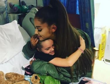 Ariana Grande hugs Lily Harrison