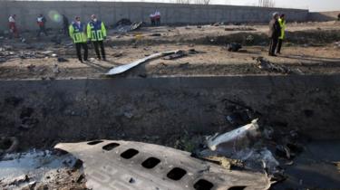 Search and rescue teams comb the wreckage of a Boeing 737 that crashed near Imam Khomeini Airport