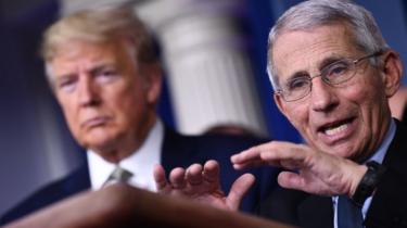 Dr Anthony Fauci speaks as US President Donald Trump listens during the daily press briefing