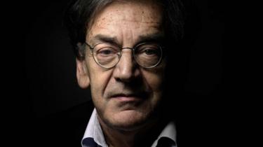 French writer and philosopher Alain Finkielkraut poses for a photograph at his home in Paris, 16 June 2015