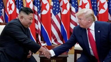 US President Donald Trump shakes hands with North Korean leader Kim Jong-un at the demilitarized zone separating the two Koreas