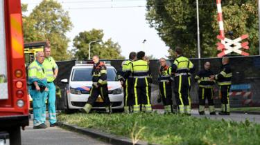 Rescue personnel work at the scene where a train struck a "cargo bicycle" in Oss, Netherlands, September 20, 2018