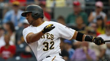 Elias Diaz #32 of the Pittsburgh Pirates hits into a double play scoring a run in the second inning against the St. Louis Cardinals at PNC Park on August 19, 2017 in Pittsburgh, Pennsylvania