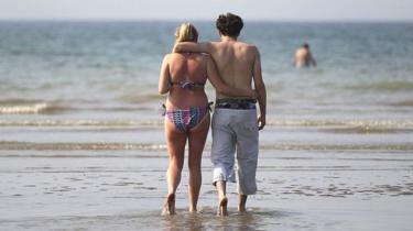 Couple walking on a beach