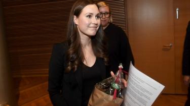 Sanna Marin holding flowers