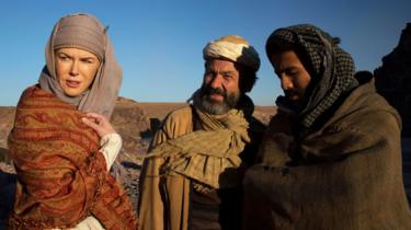 a still from Queen of the Desert, featuring Nicole Kidman as Gertrude Bell and Jay Abdo as her guide, Fattuh