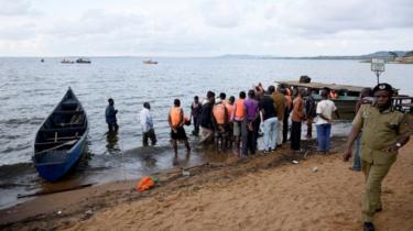 People at the scene of the Uganda sinking