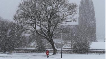 woman walking in snow