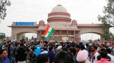 People and media gather before the arrival of Indian Air Force pilot, who was captured by Pakistan on Wednesday, near Wagah border, on the outskirts of the northern city of Amritsar, India, March 1, 2019