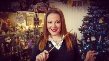 Victoria Maclean in font of some of her Harry Potter memorabilia