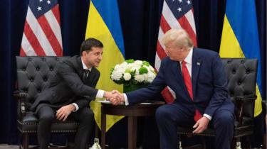 Ukraine's President Volodymyr Zelensky and US President Donald Trump shake hands during a meeting in September