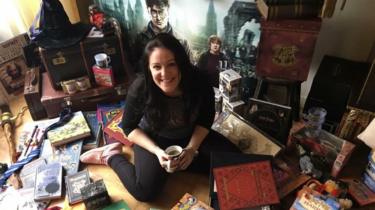 Victoria Maclean in font of some of her Harry Potter memorabilia