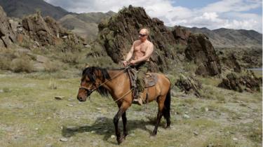 Vladimir Putin rides a horse during his holiday in Southern Siberia in August 2009