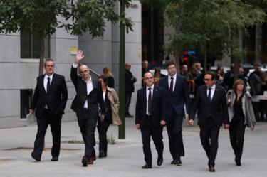 Dismissed Catalan Foreign Affairs chief Raul Romeva waves as he arrives with other dismissed cabinet members at Spain's High Court after being summoned to testify on charges of rebellion, sedition and misuse of public funds for defying the central government by holding a referendum on secession and proclaiming independence, in Madrid, Spain, November 2, 2017.