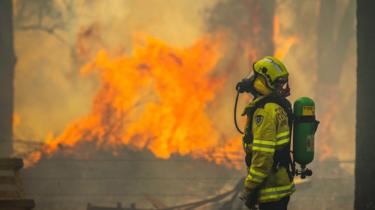 Fire and Rescue NSW responds to a bushfire burning out of control near properties in South Taree on the Mid North Coast of NSW