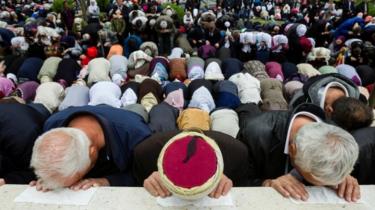 Muslims pray at the mosque, which was notorious for killings during the war