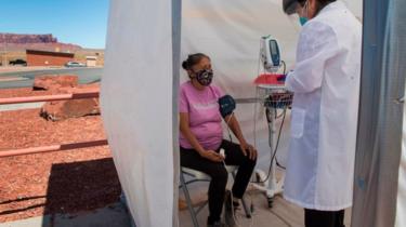 Elderly Navajo woman receiving medical attention