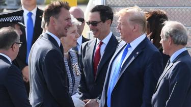 Foreign Secretary Jeremy Hunt greets US President Donald Trump as he arrives at Stansted Airport