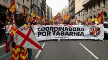 A man dressed as Sant Jordi (Saint George, patron of Aragon and Catalonia) attends a pro-Spanish demonstration held by the "Tabarnia" movement in Barcelona, Spain, 4 March 2018