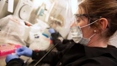 A female scientist in a coronavirus testing lab