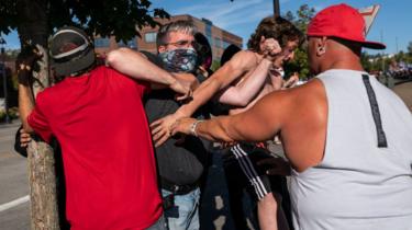 Fights broke out between anti-racism protestors and attendees of a pro-Trump rally on Saturday