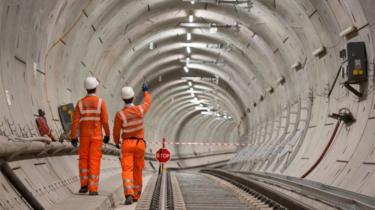 Crossrail engineers inspecting completed tracks