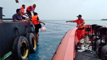 Rescuer workers recovered debris from the crash site