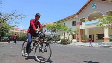 A student riding a bike