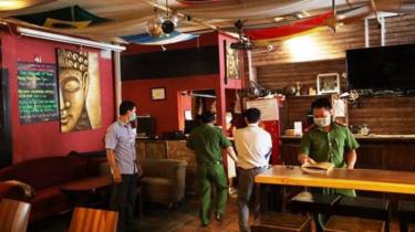 Police check the Buddha Bar after it was cleared to reopen