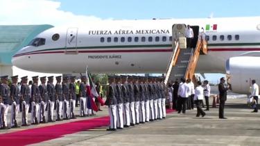 Mexico's President-elect Andrés Manuel López Obrador departs the commercial plane on Wednesday