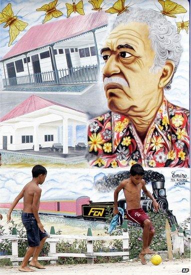 Two boys play soccer in front a mural painting of Nobel Prize-winner Gabriel Garcia Marquez in Aracataca, Colombia, Jan. 4, 2006.