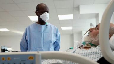Clive Myrie and a Covid patient the Royal London Hospital