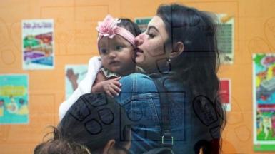 Helen, 16, arrives for classes with her daughter Jenine. At Lincoln Park High School, all the students are pregnant or expecting mums.