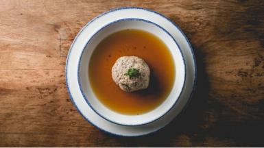 Home-made meat broth with matzo ball