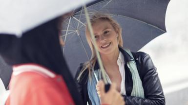 Swedish woman holding an umbrella