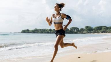 Woman running on the beach