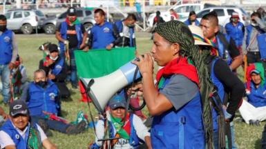 Indigenous people prepare before leaving in a caravan from Fusagasuga to Bogota, Colombia, 18 October 2020.