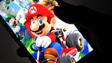 A smartphone displaying MarioKart
