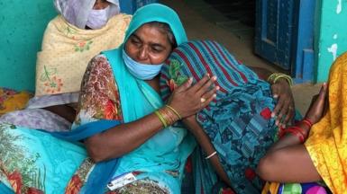 The victim's aunt consoles the 19-year-old's mother