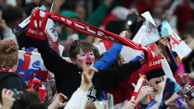 England fans hold scarves