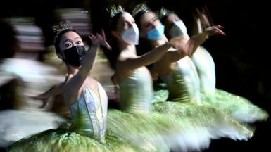 Dancers from the Berlin State Ballet - Staatsballett Berlin - wear face masks as they perform during the dress rehearsal of Don Quixote at the Deutsche Oper opera house in Berlin, Germany, on 1 December 2021