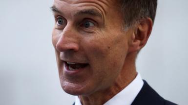 Jeremy Hunt speaks during an interview with television correspondent Robert Peston outside the BBC headquarters, in London,