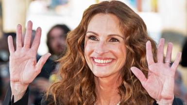 Julia Roberts raises her hands, at the Cannes Film Festival, in France, in May 2022
