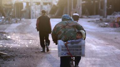 Syrians leave Darayya because of clashes between Syrian opponents and President Assad's forces, 28 January 2016